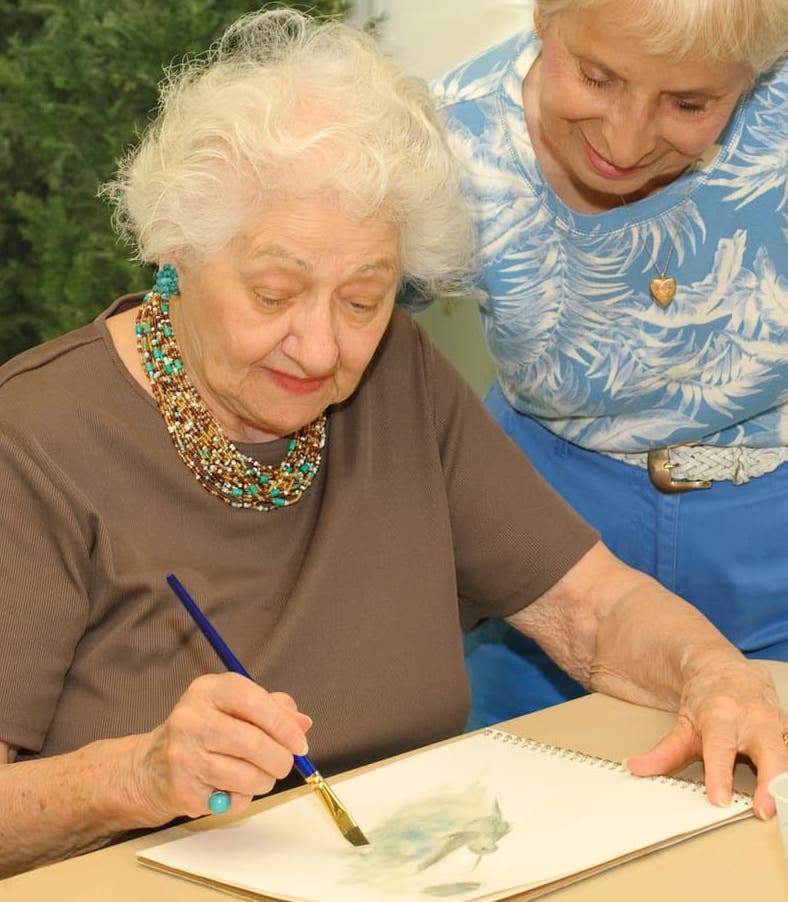 elderly woman painting