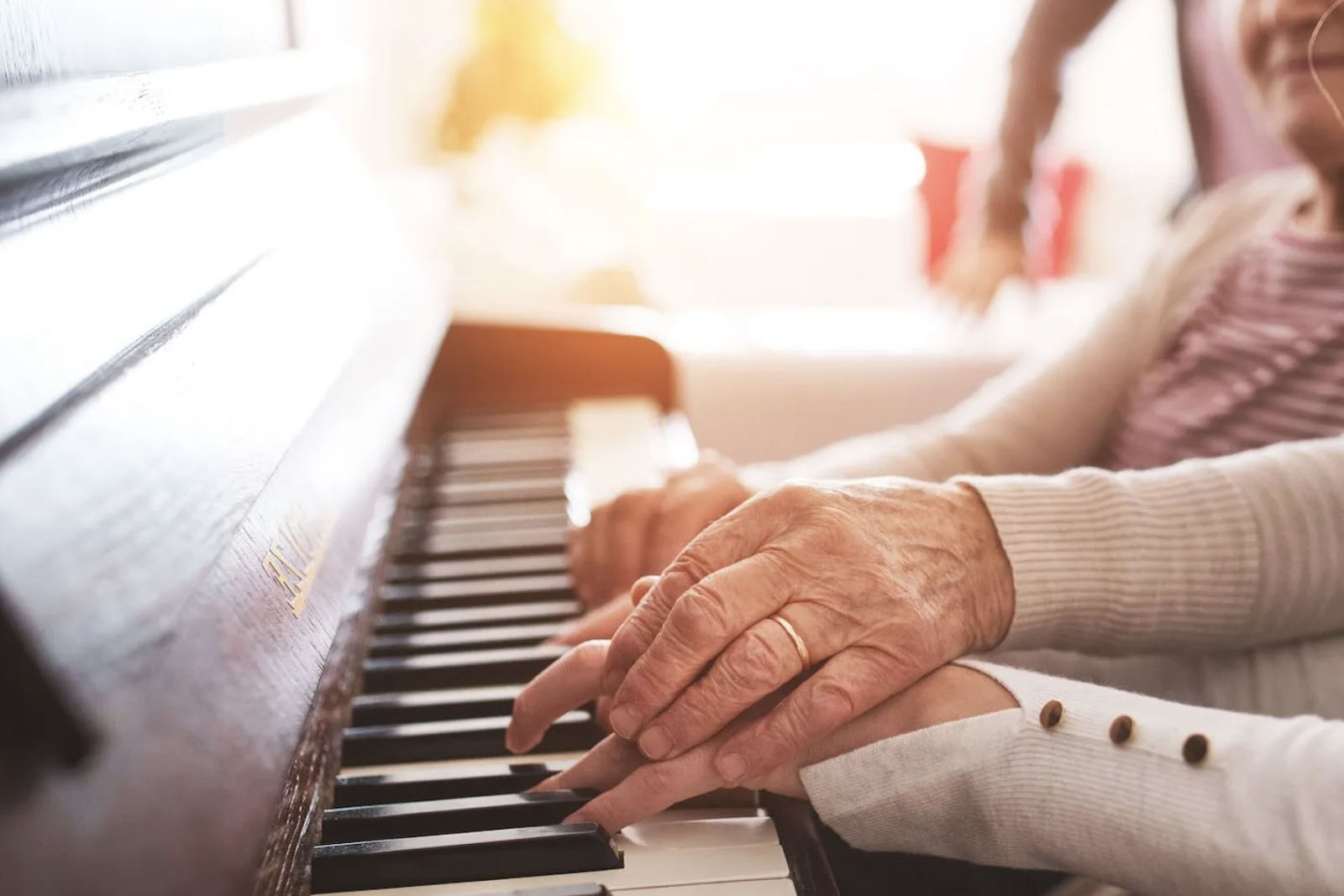 Elderly Playing A Piano