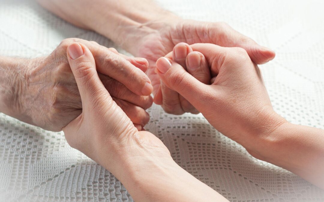 Caregiver providing emotional support to a senior at home in Connecticut