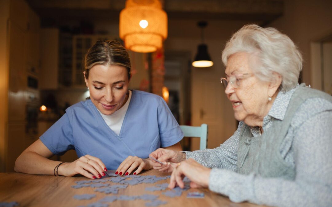 Senior engaging in brain fitness activity at home with caregiver support in Connecticut