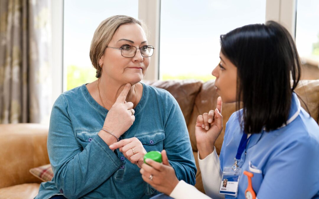 Professional caregiver supporting an older adult aging in place at home in Connecticut