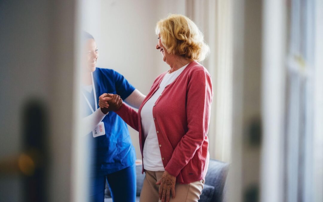 Caregiver helping a senior walk at home while reducing decision fatigue in Connecticut